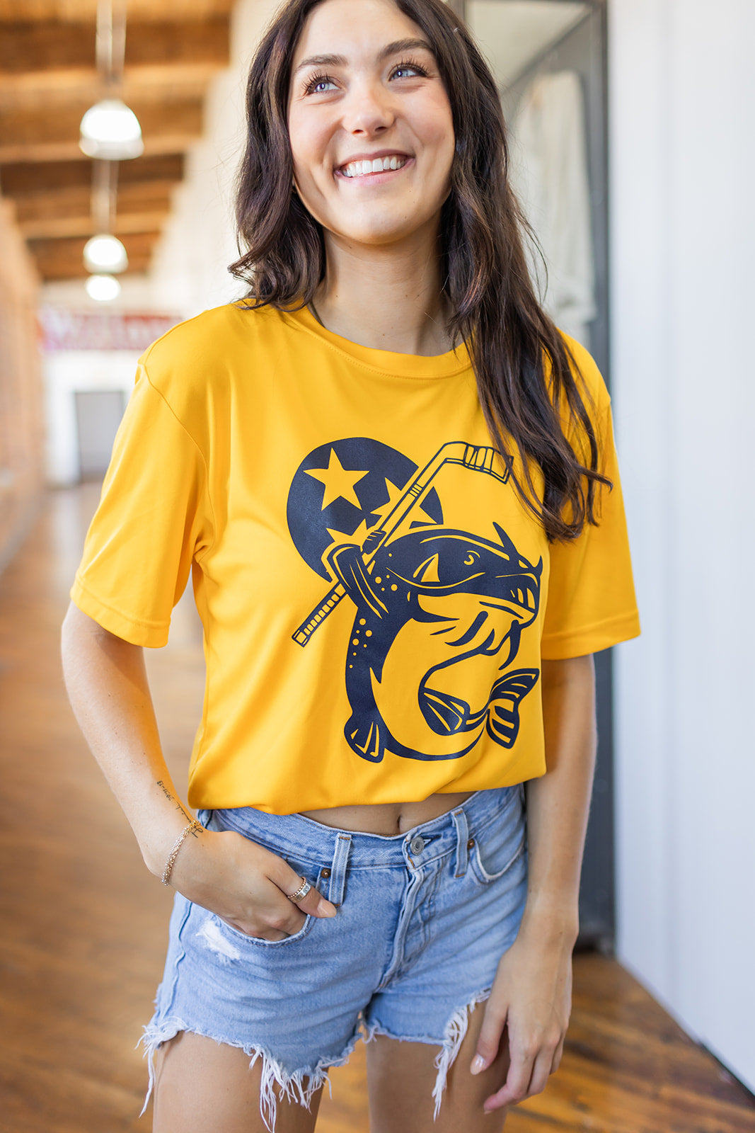Adult Performance Stanley the Catfish Gold Tee -