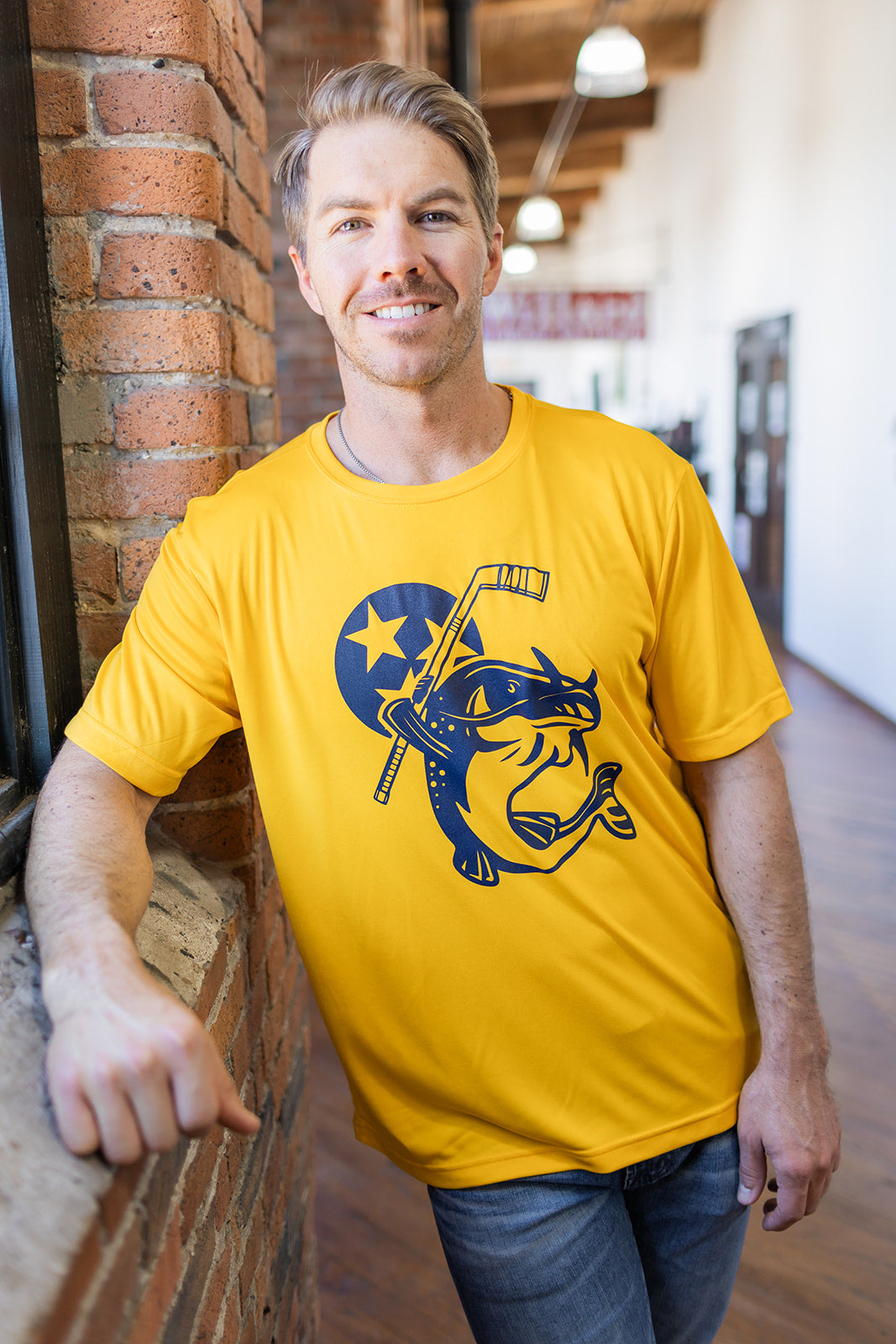 Adult Performance Stanley the Catfish Gold Tee -