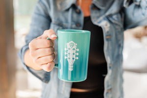 
                  
                    Load image into Gallery viewer, 14oz Teal Nashville Guitar Mug -
                  
                